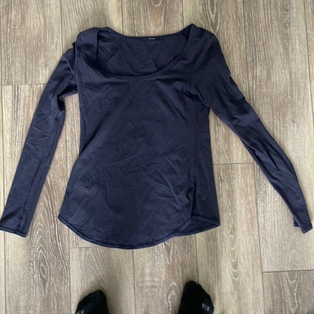 Size 6 lululemon navy scoop neck long sleeve. Slight mesh detail.